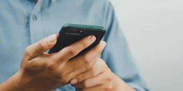 A close up view of a smart phone in someones hands.